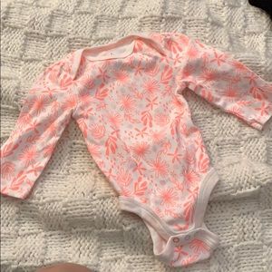 0-3M onesie with orange floral pattern